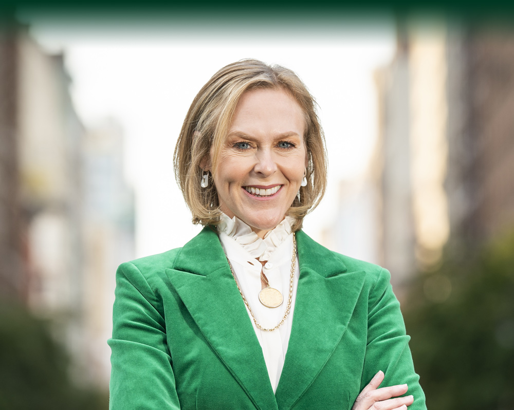 Debbie Epstein in a green suit jacket