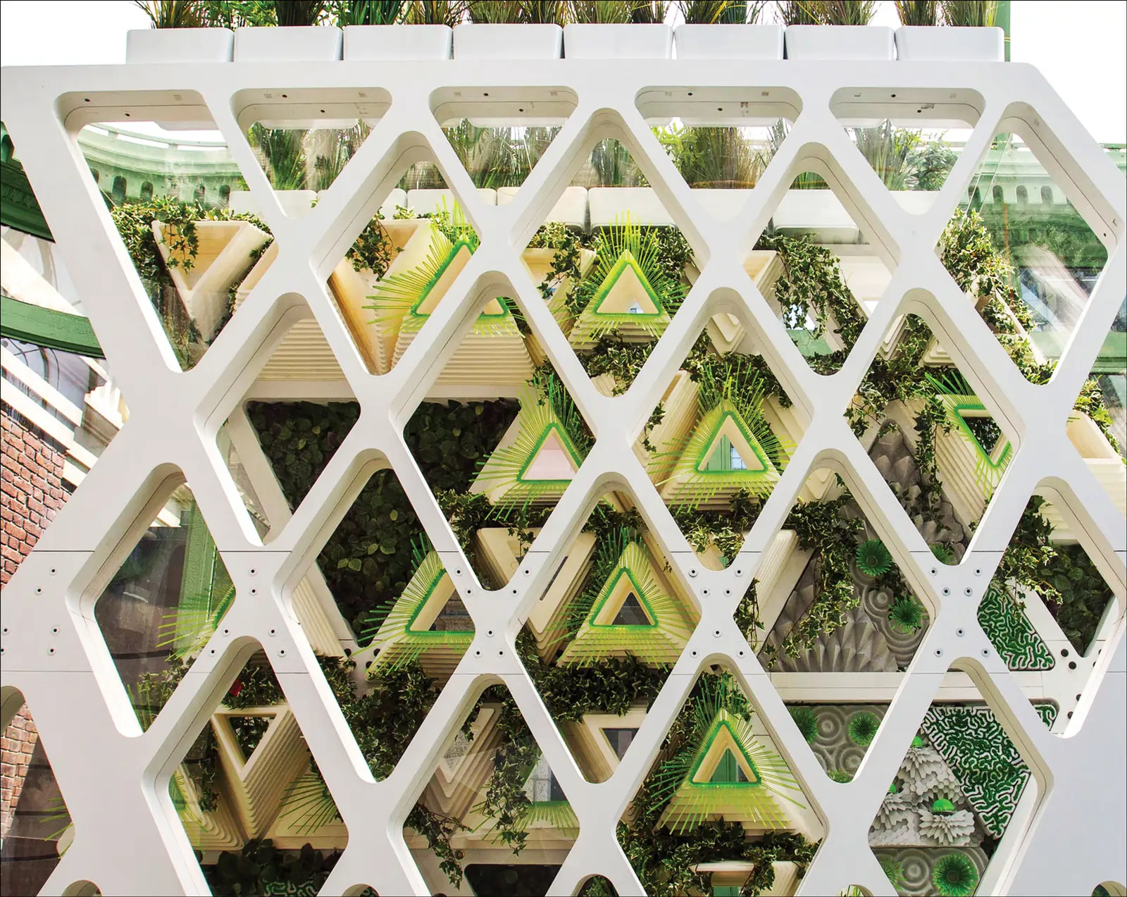 Terreform ONE designed this seven-story-tall habitat for monarch butterfl ies as part of the doubleskin, climate-controlled façade, solarpaneled green roof, and atrium of a commercial building in New York City (building model shown here). Mitchell Joachim is the project’s principal investigator. Courtesy of Terreform ONE.